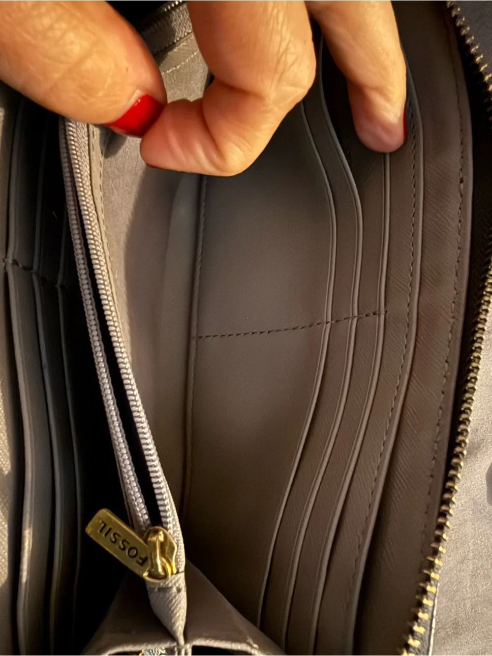 Fossil wallet and fossil wristlet clip